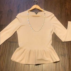 Gorgeous rose/beige top with ruffle waist detail.